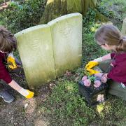 Cadets from 1330 Warrington Squadron RAF Air Cadets tidying up war graves