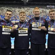 James Guy, left, with the Great Britain gold medal winning team