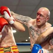 The fight gets stopped as Dan Bonner lays into his Turkish opponent Enis Yunusoglu at the DW Stadium in Wigan