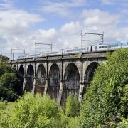 A train travelling over the Nine Arches