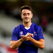 England's Alex Mitchell applauds the fans after exchanging shirts with a Samoa player at the end of the Rugby World Cup 2023, Pool D match at Stade Pierre Mauroy in Lille, France.