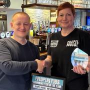 Mark Cleverly, of  Proper Pubs, presents the award to Chapel House operator Katie John