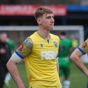 Kacper Pasiek and Tom Hannigan look dejected following Warrington Town's late defeat to Gloucester City