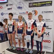 Julie Hicken (third from left) and her Great Britain teammates celebrate winning bronze at the European Masters Indoor Championships