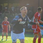 Peter Clarke celebrates scoring against Scarborough