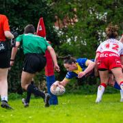 Stevie Donougher scores for Wire against St Helens in the Women's Challenge Cup
