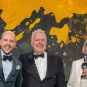 From left, comedian Tom Allen with Tim Bird and Mary McLaughlin as they win the Best Drinks Act at the Publican Awards 2024