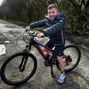 Harvey Goodman will cycle to four football stadiums in north west