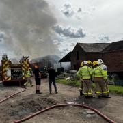 Firefighters tackle a blaze at a farm on Hall Drive