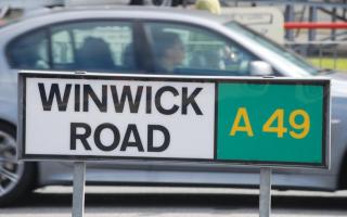 A collision between an ambulance and a Land Rover has caused significant traffic on Winwick Road