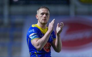 Ben Currie applauds the Wire fans following the win over Hull KR