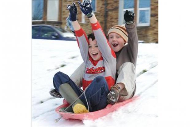 Children enjoy the Easter snow in Consett, County Durham