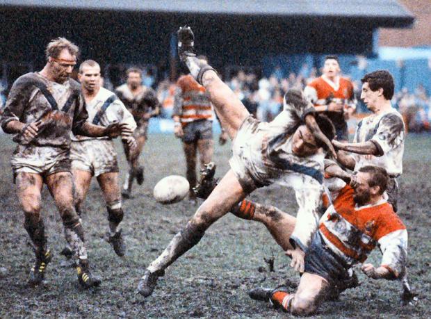 Warrington Guardian: Paul Cullen's in mid-flight as the ball falls into the patch of his Warrington Wolves teammate Bob Jackson. Picture: Eddie Whitham