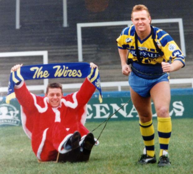 Warrington Guardian: Kevin Ellis building his strength by giving teammate Mark Forster a sleigh ride in the early 1990s. All pictures by Mike Boden 
